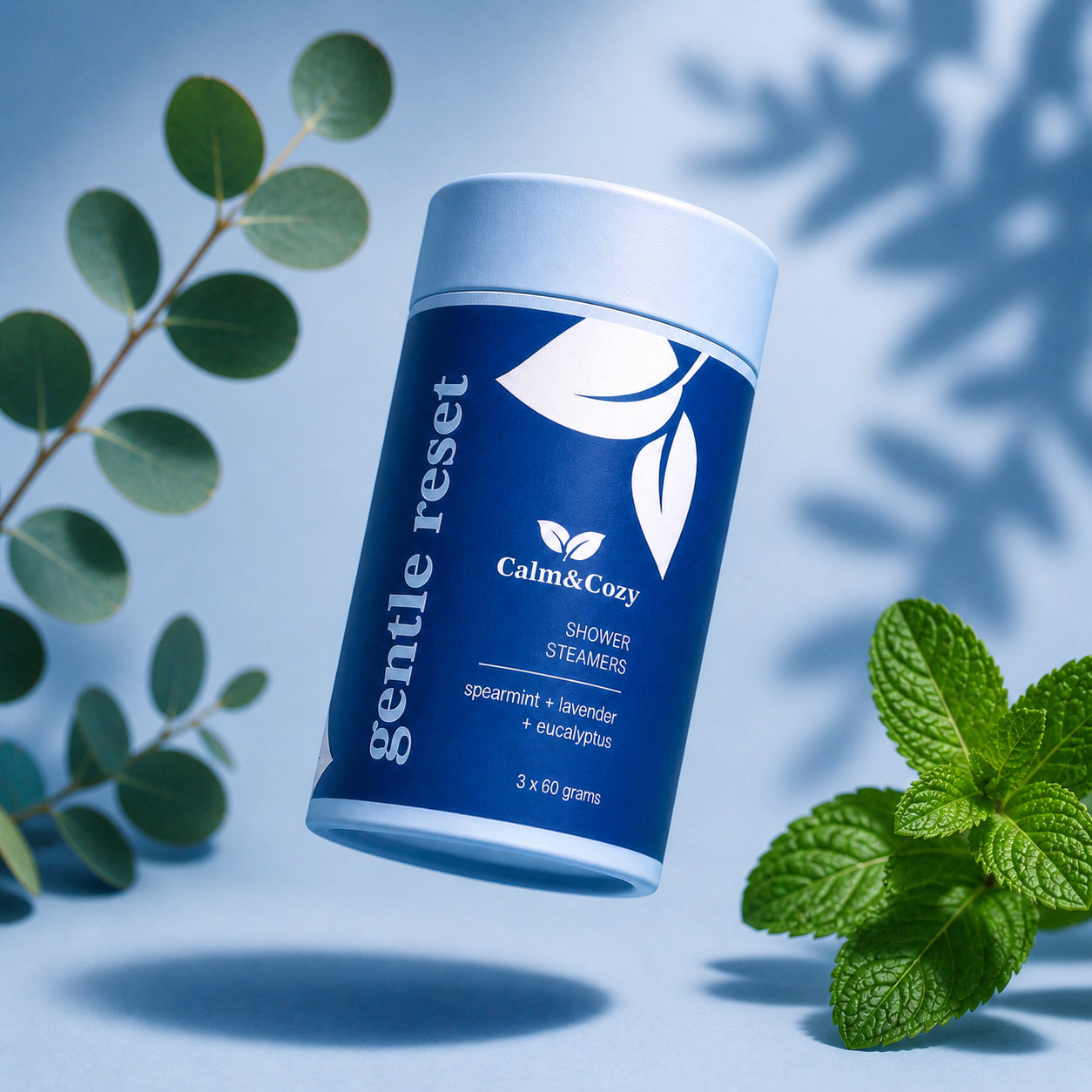 Calm & Cozy gentle reset shower steamers with lavender eucalyptus and spearmint in blue cylinder packaging